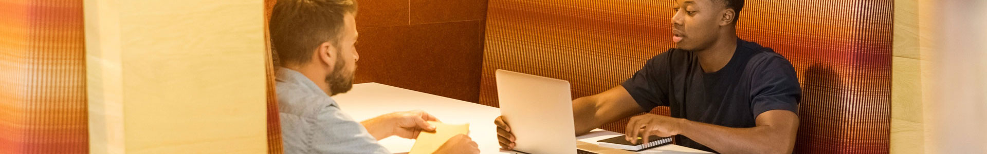 2 people meeting for a business meeting in a cafe